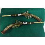 Pair of ornamental Pistols, with polished brass mounts, each 49”W