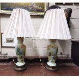 A pair of painted green opaque glass electric Table Lamps decorated with continental watermill