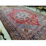 Rich red ground Iranian Carpet of the Mashad Region, traditional floral medallion pattern (large