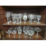 2 shelves of engraved wine, champagne and sherry glasses