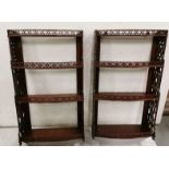 Matching Pair of mahogany four-tiered Wall Shelves with pierced decoration and open backs,