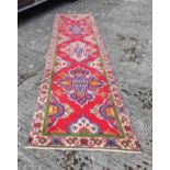 Vintage red ground Tabriz Runner, multi-coloured red medallion design, 3.2m x 0.92m