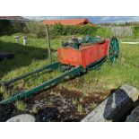 Old Fire Cart, with wooden wheels, painted green, wooden shafts, metal fire seat