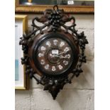 Black Forest French Movement Vineyard Clock, with applied enamelled Roman Numerals to the face,