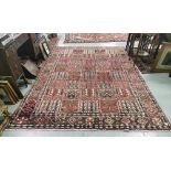 Full pile Persian Bokhara Carpet, with a traditional fine style Persian panel design, muted