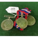 Three x World War II Gallantry Medals (2 with blue and red ribbons), including a George VI Defence