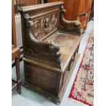 19th Century Continental Oak Hall Bench, the carved back panel featuring a mask of possibly an