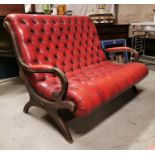 Mahogany and leather Chesterfield sofa.