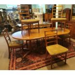 Mid-century extending dining room table with eight chairs.