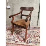 19th C. elm open armchair.