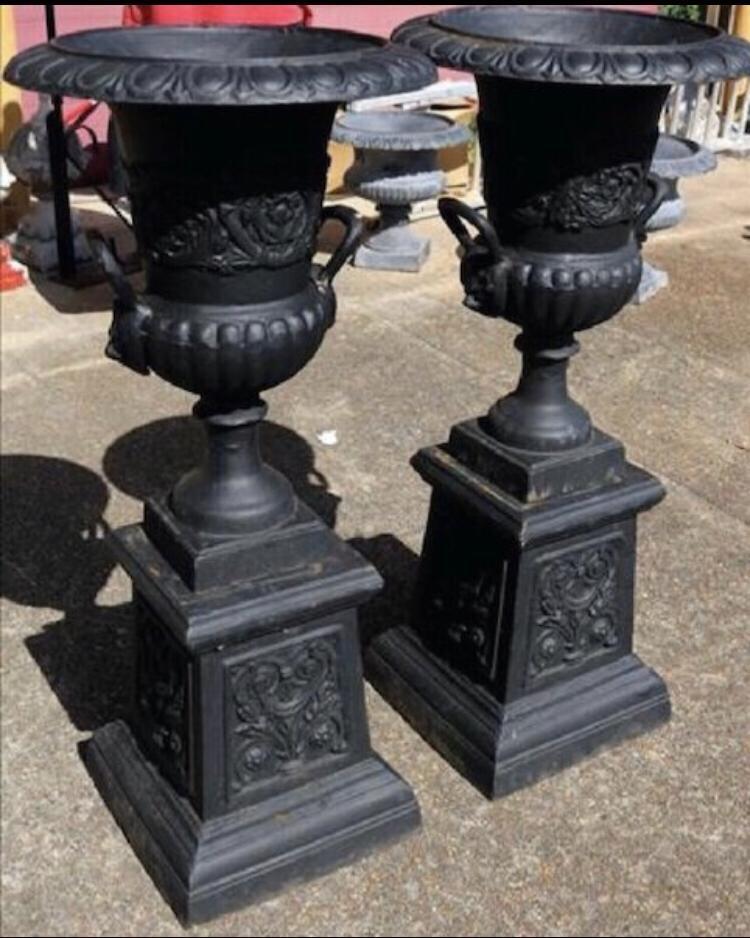Pair of cast iron urns.