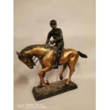 Model of a bronze jockey and horse.