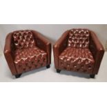 Pair of deep buttoned leather club chairs.