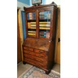 Regency mahogany two door bureau book.