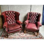 Near pair of Oxblood leather wingback armchairs.