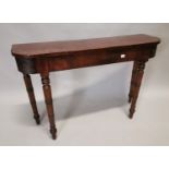 Regency mahogany table on turned legs {111 cm H x 74 cm W x 33 cm D}.