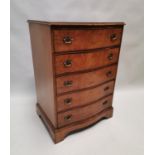 Burr walnut serpentine chest of drawers.