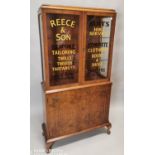 Reece & Son Bespoke Tailoring advertising cabinet.