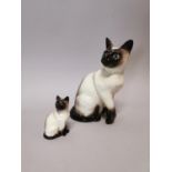 Two ceramic models of Cats.