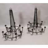 Pair of wrought iron hanging candelabras.