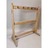 Early 20th C. painted pine coat rack.