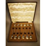 Set of twelve English silver coffee bean spoons