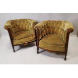 Pair of Edwardian mahogany upholstered tub chairs.