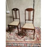 Pair of Edwardian inlaid mahogany sidechairs.