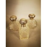 Three molded glass scent bottles