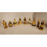 Collection of ceramic figurines.