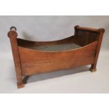 Early 19th C. fruit wood dogs bed.