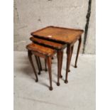 Nest of three Edwardian mahogany tables.