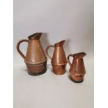 Set of three 19th C. graduating copper jugs.