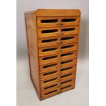 Mid-century maple bank of haberdashery drawers.