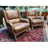 Pair of designer leather wing back chairs.