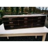 19th C. painted pine bank of nine drawers.