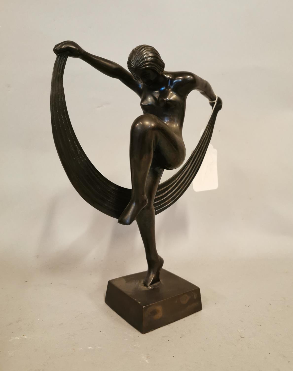 Bronze figurine of a lady.