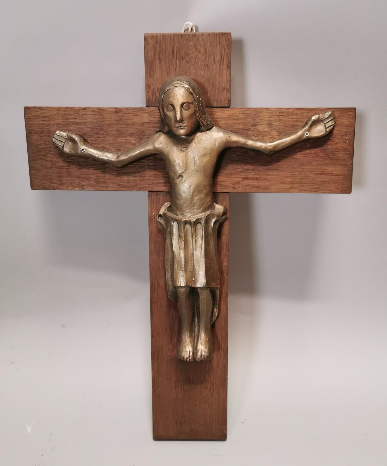 Contemporary crucifix on an oak cross.