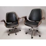 Pair of leather and chrome desk chairs.