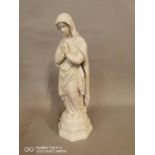 Ceramic figure of the Virgin Mary.