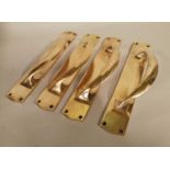 Set of four bronze door handles.