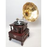 Mahogany gramophone with brass horn.