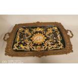 Decorative brass and ceramic serving tray.