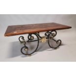 Wrought iron and brass coffee table.
