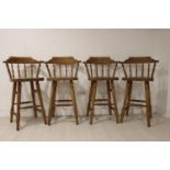 Set of four smoker's bow bar stools.