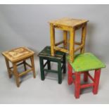 Set of four painted pine stools.