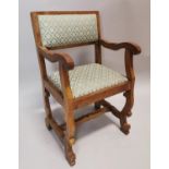 Early 20th C. oak and upholstered chair.