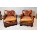 Pair of early 20th C. leather club chairs.