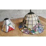 Two leaded stain glass light shades.