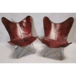 Pair of retro leather and metal butterfly chairs.